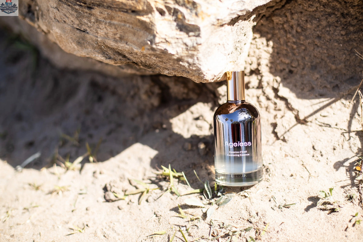 LILIXIR Ageless Awakening Essence mist in a clear spray bottle with a minimalist design, ready to refresh and hydrate skin.
