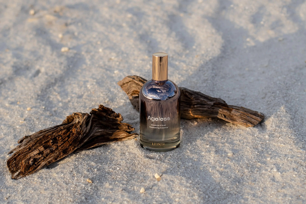 LILIXIR Ageless Awakening Essence mist in a clear spray bottle, designed for revitalizing and hydrating the skin.