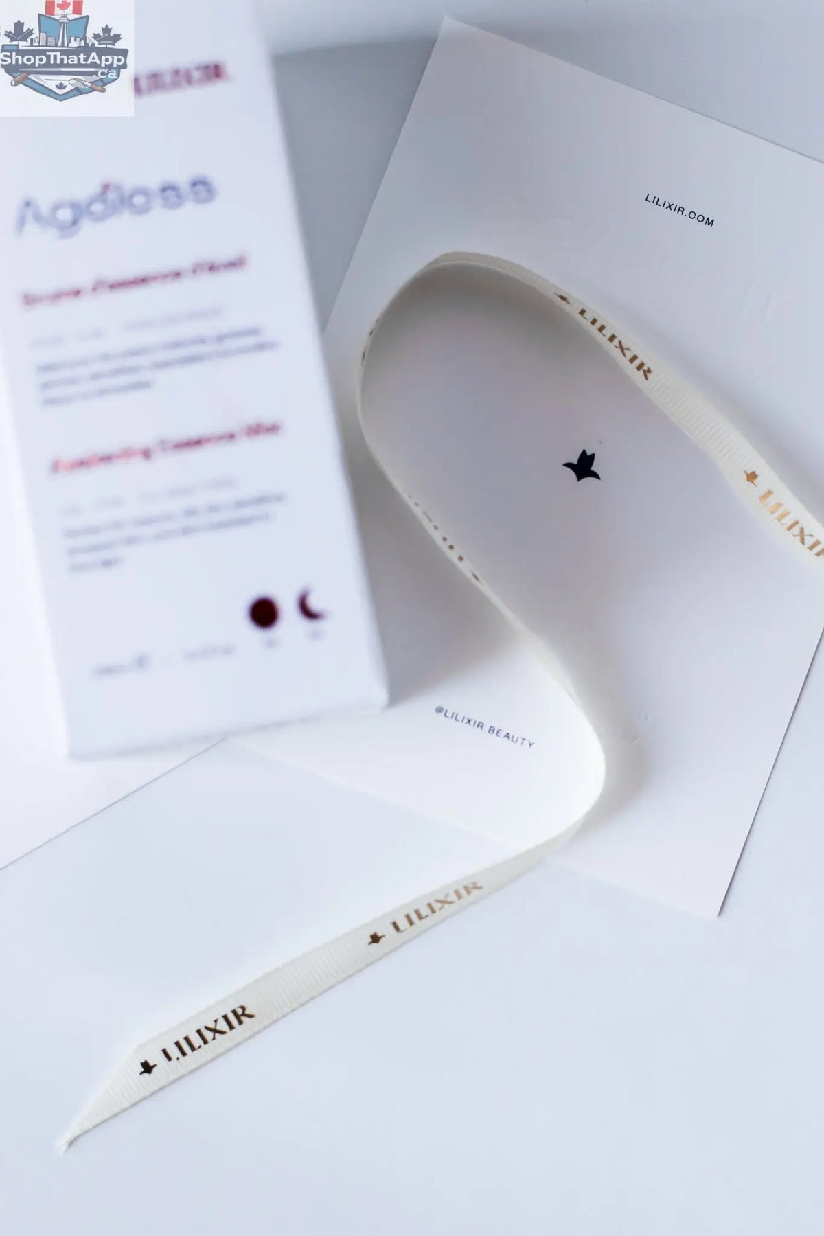 LILIXIR Ageless Awakening Essence mist in a sleek box, featuring a clear spray bottle with a minimalist label and elegant packaging.