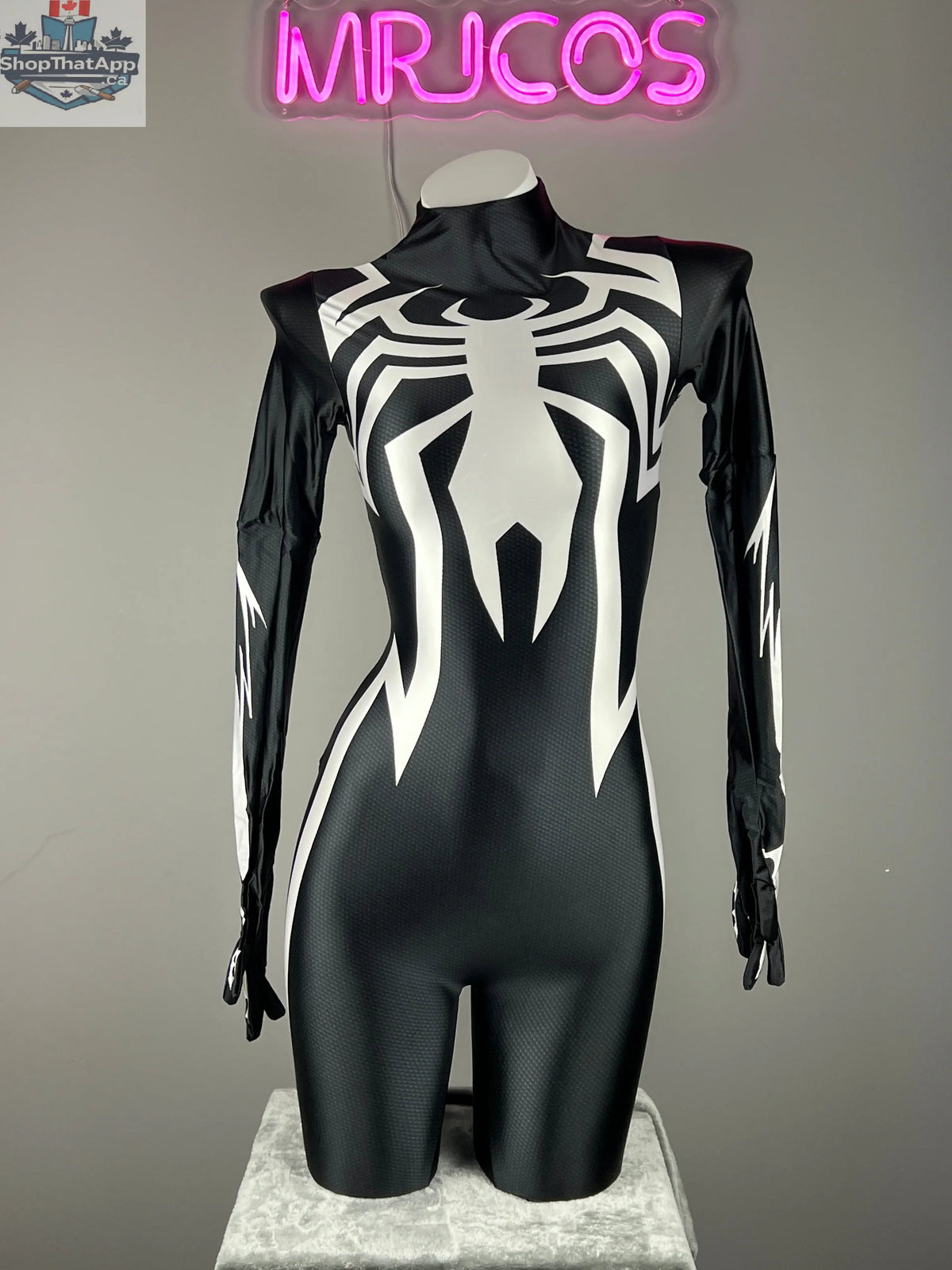 Woman in MRJCOS superhero bodysuit cosplay, full black spandex Zentai costume with mask for Halloween or costume events.