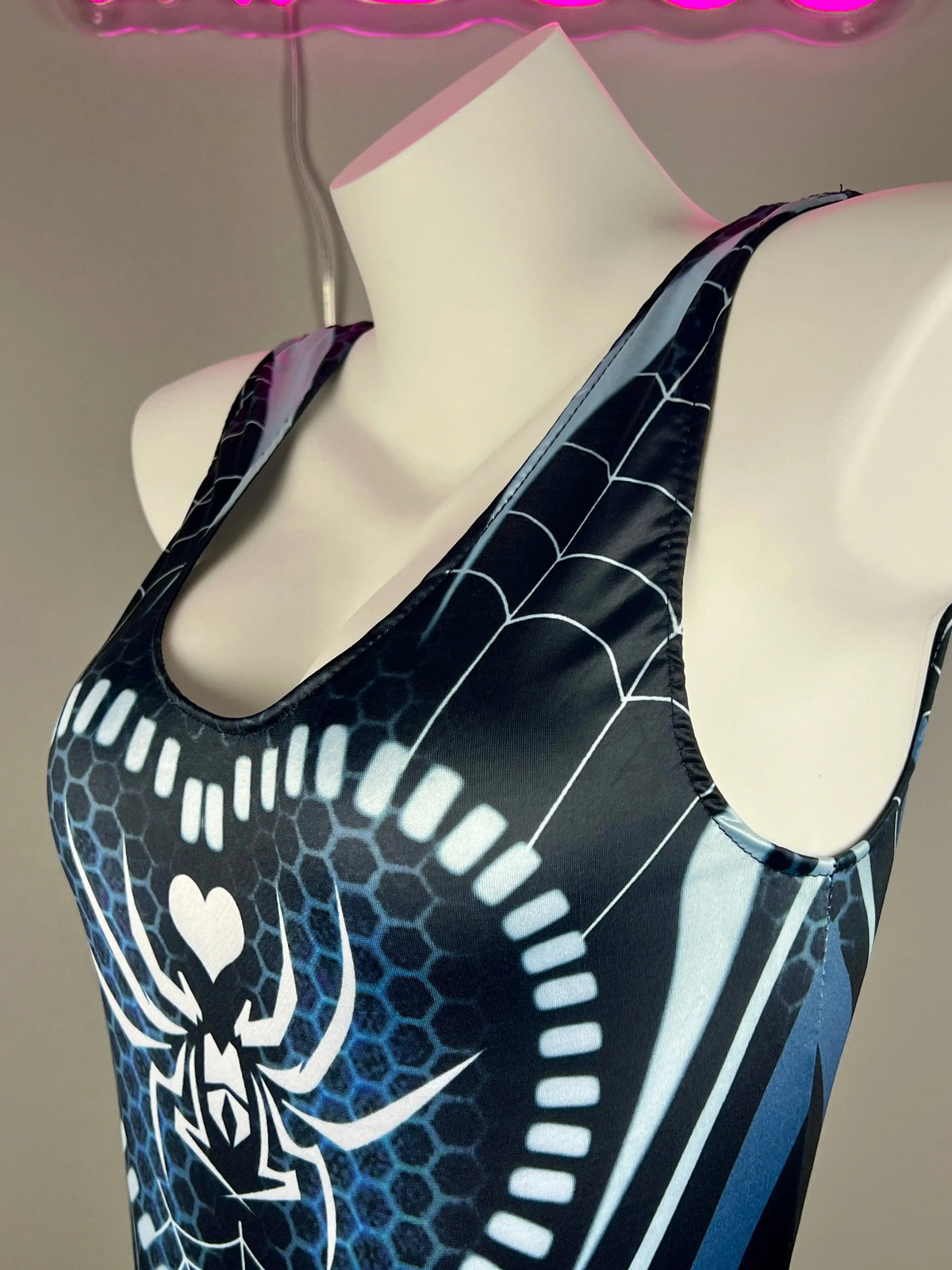 Woman wearing MRJCOS superhero-themed crotchless lingerie bodysuit, bold sexy cosplay costume for women, front view.