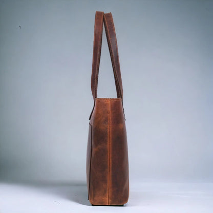 NAB Leather classic brown leather tote bag with sturdy handles and spacious interior, ideal for everyday use and versatile style.