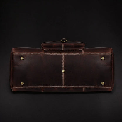 Full-grain distressed brown leather Voyager Duffle bag by NAB Leather, showcasing its spacious design and sturdy hand-stitched details.