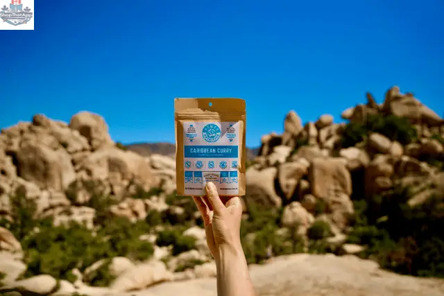 Nomad Nutrition Caribbean Curry Mix in a 56g package, vegan, gluten-free, dehydrated plant-based food for flavorful dishes.