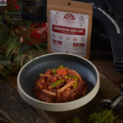 Dehydrated Hungarian Goulash half portion by Nomad Nutrition, showcasing a hearty, plant-based, gluten-free outdoor meal in a packaged bag.
