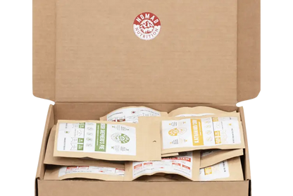 Nomad Nutrition Power Pack with 9 vegan protein single-serving dehydrated food packs in 112g portions, gluten-free and plant-based.