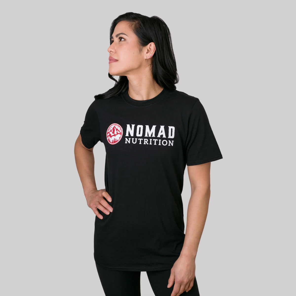 Nomad Nutrition Nomad Logo Tee, a stylish and comfortable T-shirt for adventurers with Nomad branding and shadow graphic design.