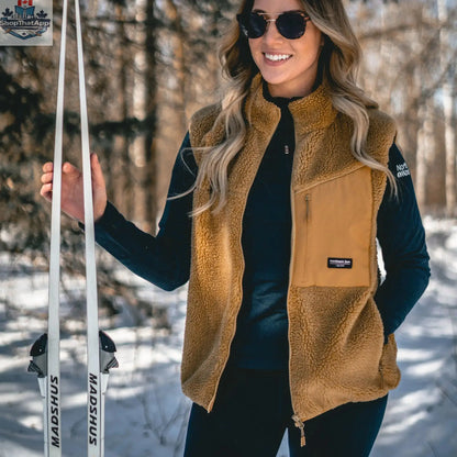 Unisex Northern Sun Sherpa vest with a cozy fleece exterior and quilted interior, perfect for casual outdoor wear.