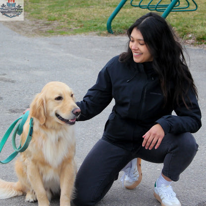 Northern Sun women's 3-in-1 waterproof winter jacket, versatile for all weather, shown in black with a woman walking her dog.