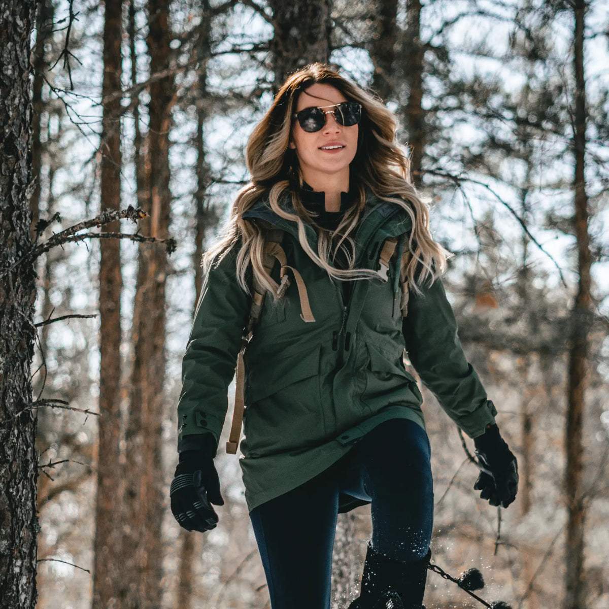 Northern Sun women's 3-in-1 waterproof winter jacket in forest green, mid length with hood and insulated lining for cold weather.