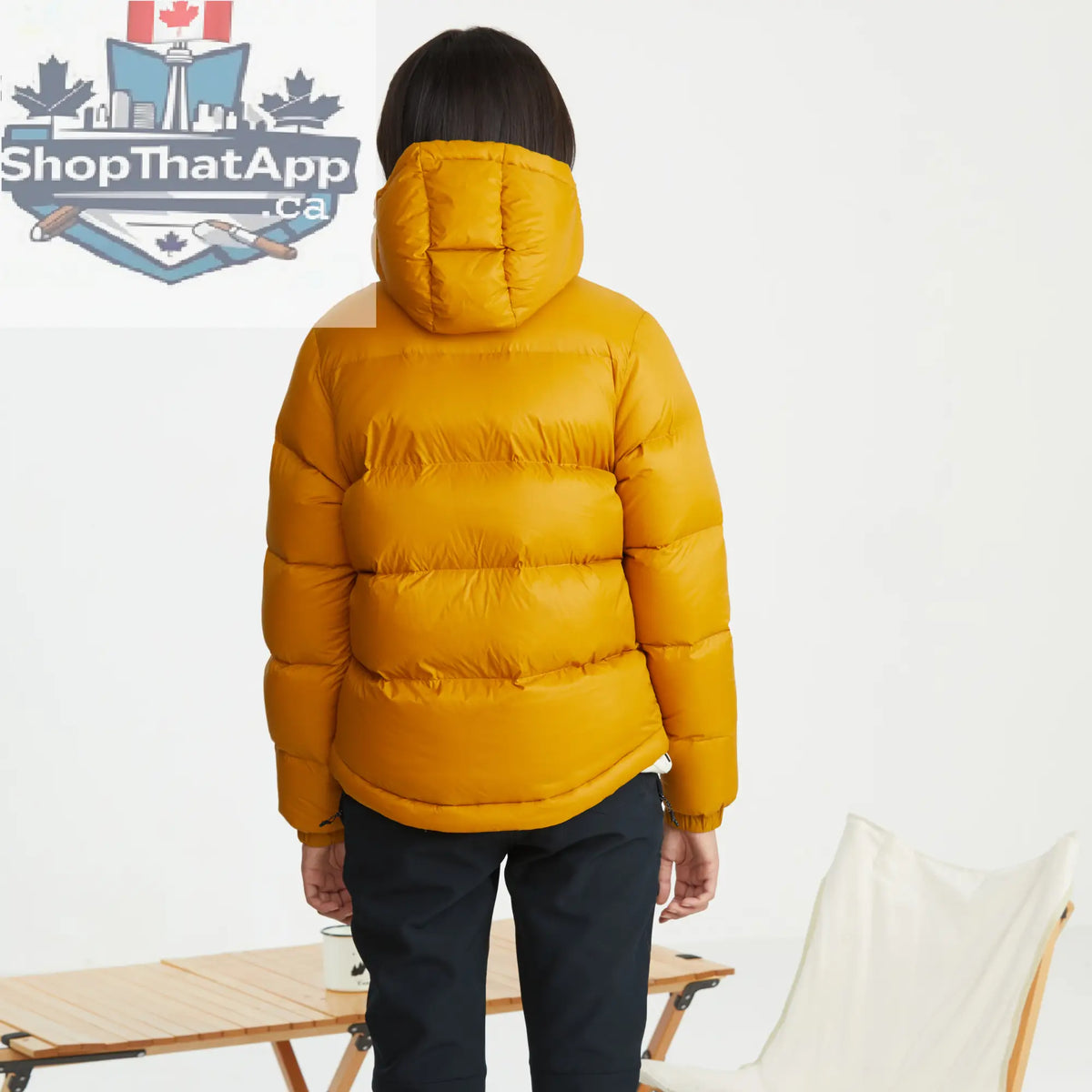 Northern Sun women's puffer down jacket with hood, showing the back view in a winter outdoor setting.