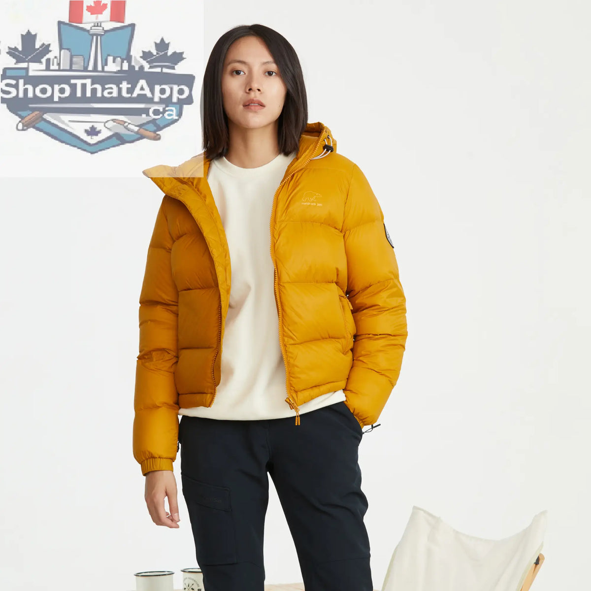 Yellow women's puffer down jacket by Northern Sun, winter parka with quilted design and hood for cold weather warmth.