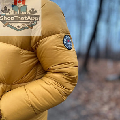 Northern Sun women's puffer down jacket with water-resistant fabric, featuring a quilted design and hood for winter warmth.