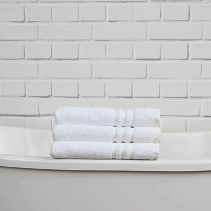 Stack of soft, plush Patricia towels from Skylark+Owl Canada in neutral tones, showcasing their thick and absorbent bath towel design.
