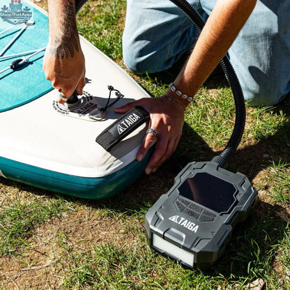 Taiga Board premium electric pump for inflatable paddle boards, battery-operated, 22 PSI, portable accessories for quick inflation.