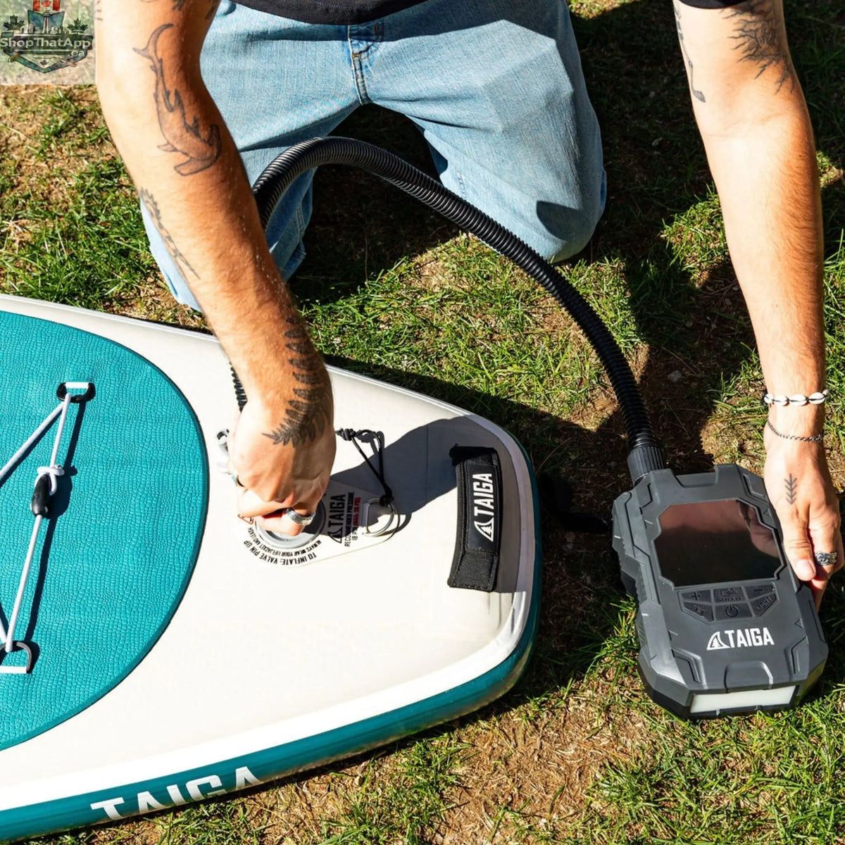 Taiga Board premium electric pump for inflatable paddle boards, battery-operated, inflates up to 22 PSI, portable accessories.