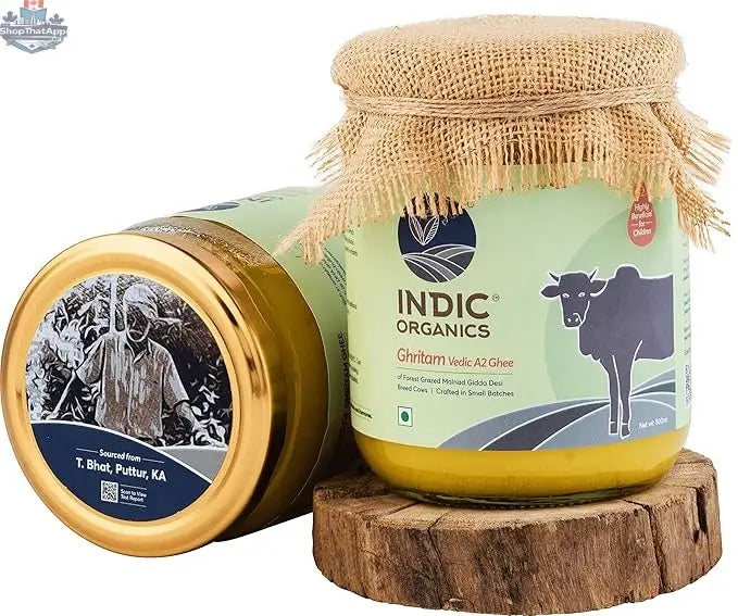 Indic Organics Malnad Gidda A2 Desi Cow Ghee from Prithvi Mart, pure and premium cultured ghee with cows grazing in a forest setting.