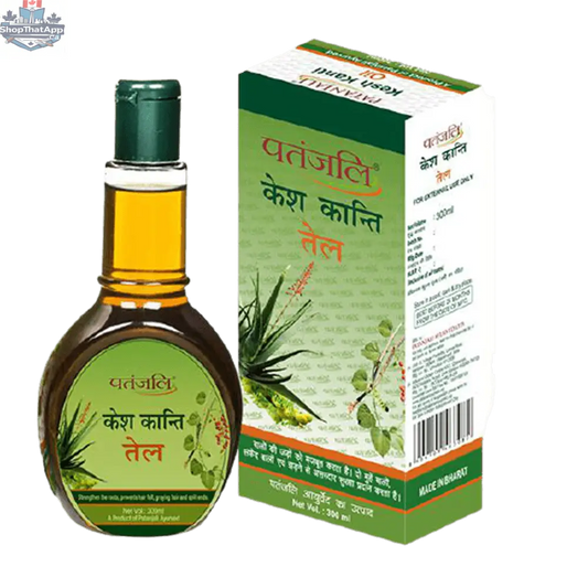 Patanjali Kesh Kanti Hair Oil in a clear bottle with a yellow label, featuring natural ingredients and a dropper applicator.