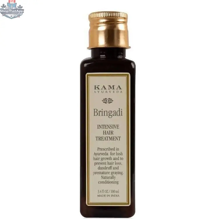 Kama Ayurveda Bringadi Hair Oil for intensive hair treatment, featuring a dark glass bottle with a dropper, surrounded by herbs.