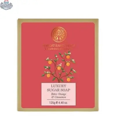 Luxury Bitter Orange Cinnamon Sugar Soap from Forest Essentials with a textured soap bar and natural ingredients on a gentle surface.