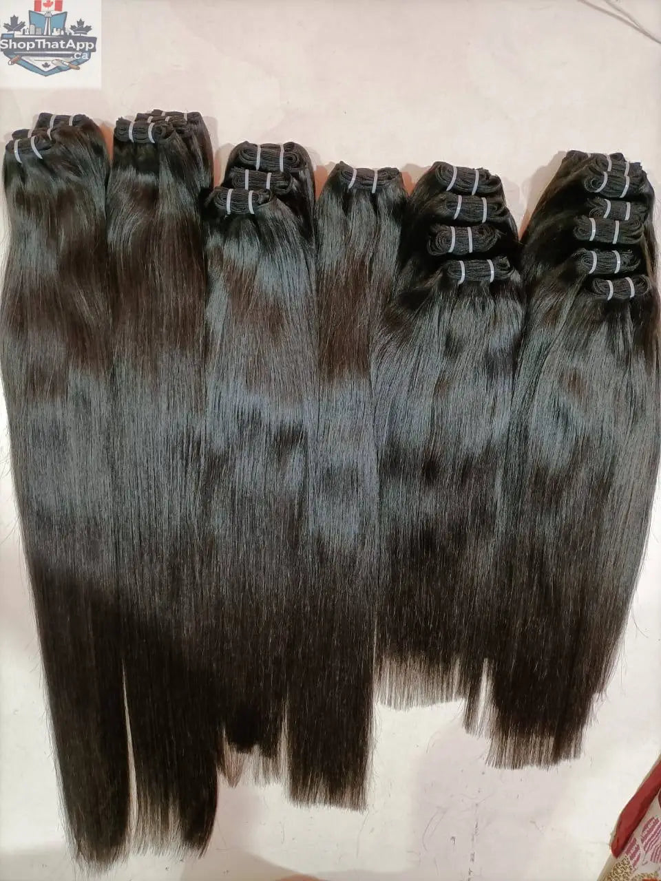 Indian straight hair bundles from Prithvi Mart showcasing natural, raw hair extensions with a smooth, straight texture.
