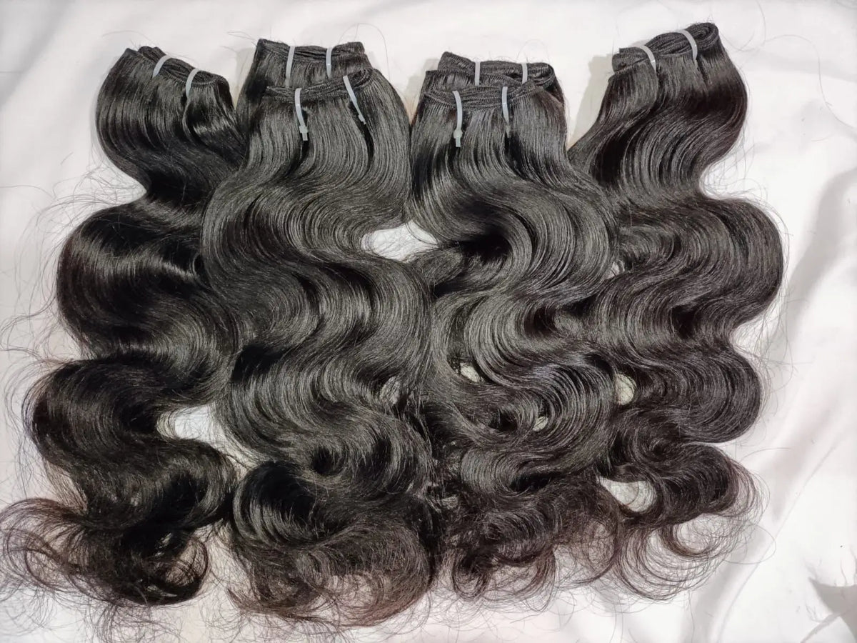 Indian Virgin Body Wave Hair extensions bundles by Prithvi Mart, showcasing smooth, wavy hair for wholesale and retail use.