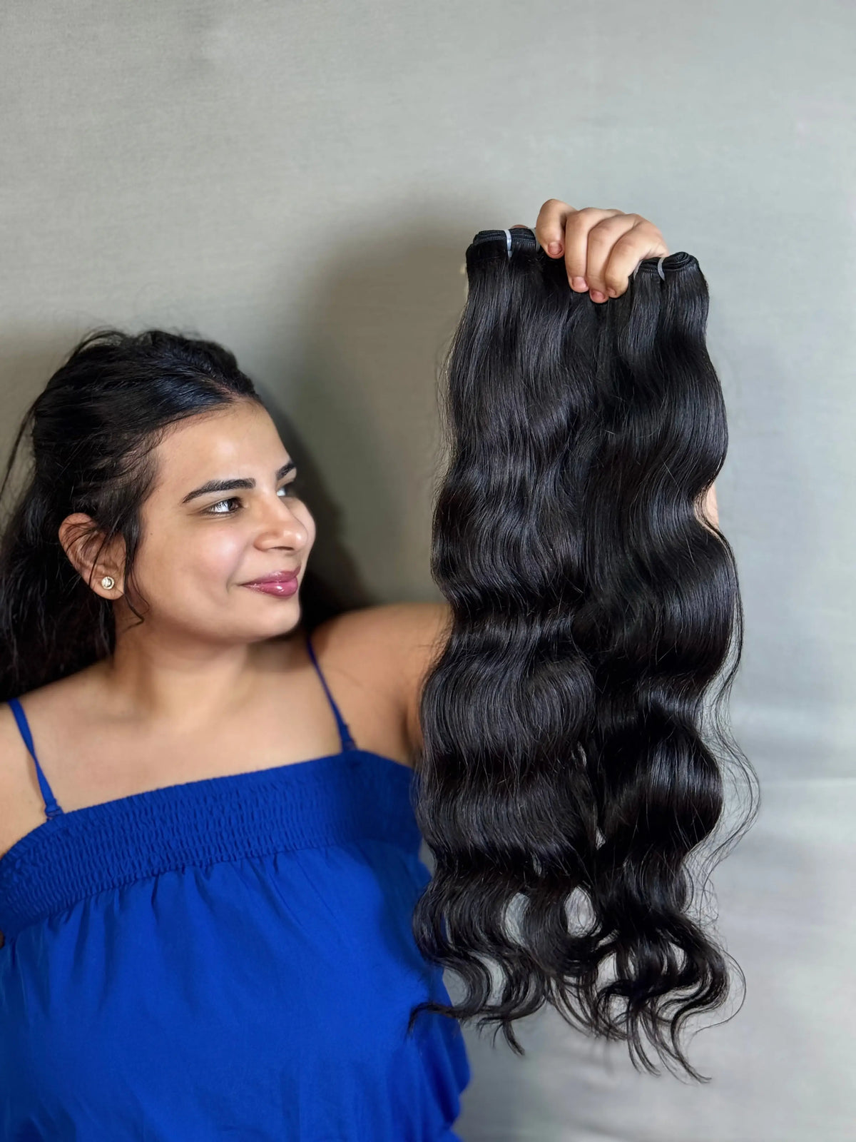 Indian Virgin Wavy Hair extensions by Prithvi Mart, showcasing luxurious, natural wavy hair bundles for versatile styling.