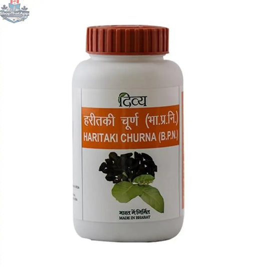 Patanjali Haritaki Churna in a jar, herbal wellness powder by Prithvi Mart, with fresh green haritaki fruit and powder visible.