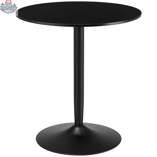 Modern black round dining table by SLOTH Nation with steel base, perfect for small spaces in home dining rooms.
