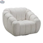 Modern Riro Swivel Accent Chair by Hygge Design House, angled view showing plush fabric upholstery and sleek armrest design.