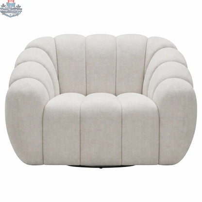 Cream Riro swivel accent chair by Hygge Design House with plush channeled upholstery and a modern, rounded design.