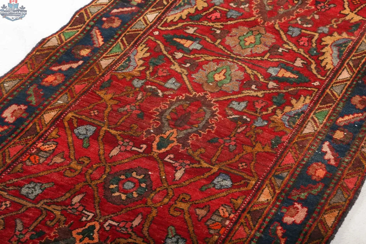 Persian Azerbaijan runner rug measuring 2' 7" x 10' 4' with intricate traditional patterns, handcrafted by Rug the Rock.