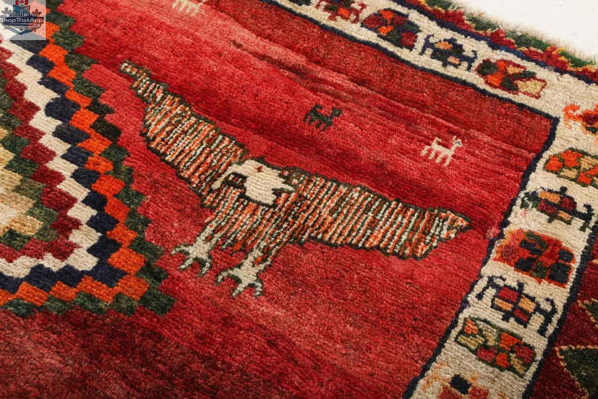 Persian Shiraz rug measuring 5' 11" x 6' 9' with intricate traditional patterns in rich colors, from Rug the Rock.