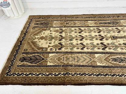 Persian Baluch Rug by Rug the Rock, 3' 5” x 6' 1”, with intricate traditional patterns and rich colors.