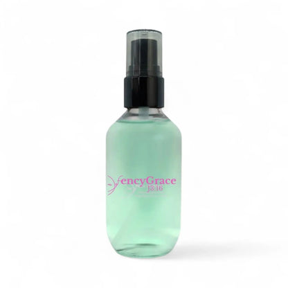 FencyGrace vegan setting spray with long-lasting hold and natural finish, shown in a clear spray bottle with a white label.
