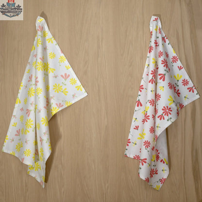Two printed Shy Dragonfly Tea Towels with yellow accents hanging, made by Hem And Tassel for kitchen decor.