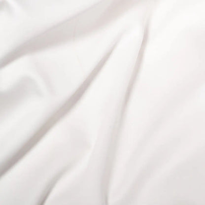 White Skylark+Owl Canada sateen duvet cover set with smooth, luxurious bedding fabric and elegant stitching details.