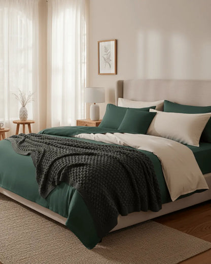 Skylark+Owl Canada refined sateen duvet cover set in chalk and forest colors, showcasing smooth, luxurious bedding fabric.