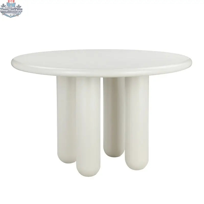 Hygge Design House Nubi Round Dining Table with wooden top and sleek legs, ideal for modern dining spaces