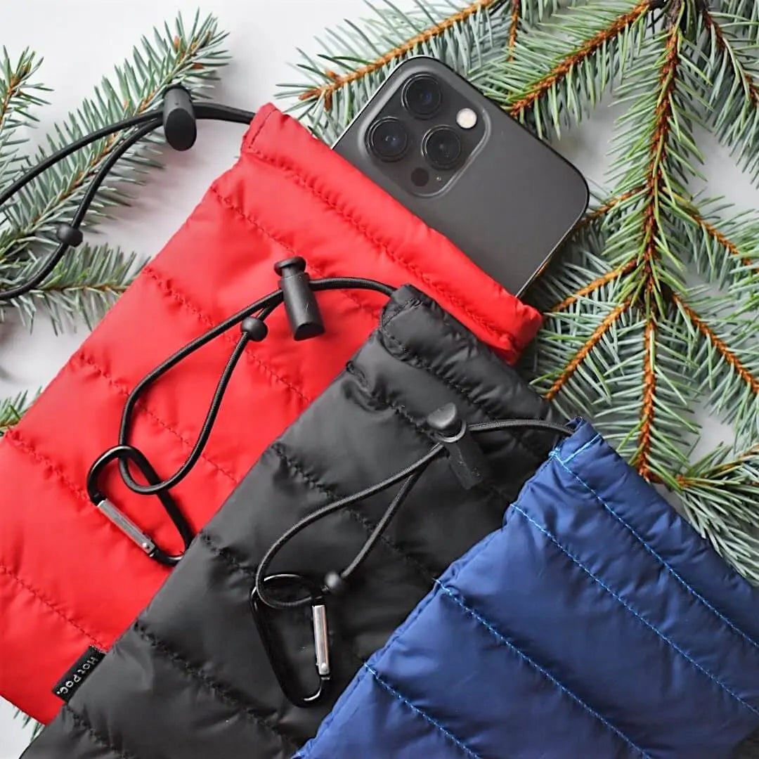 Hot Poc Eco Reusable Heat Pack sleeper in three colors, designed for outdoor phone protection and warmth.