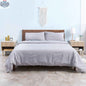 Pair of modern natural wood nightstands with drawers and open shelves from SLOTH Nation bedroom furniture set.