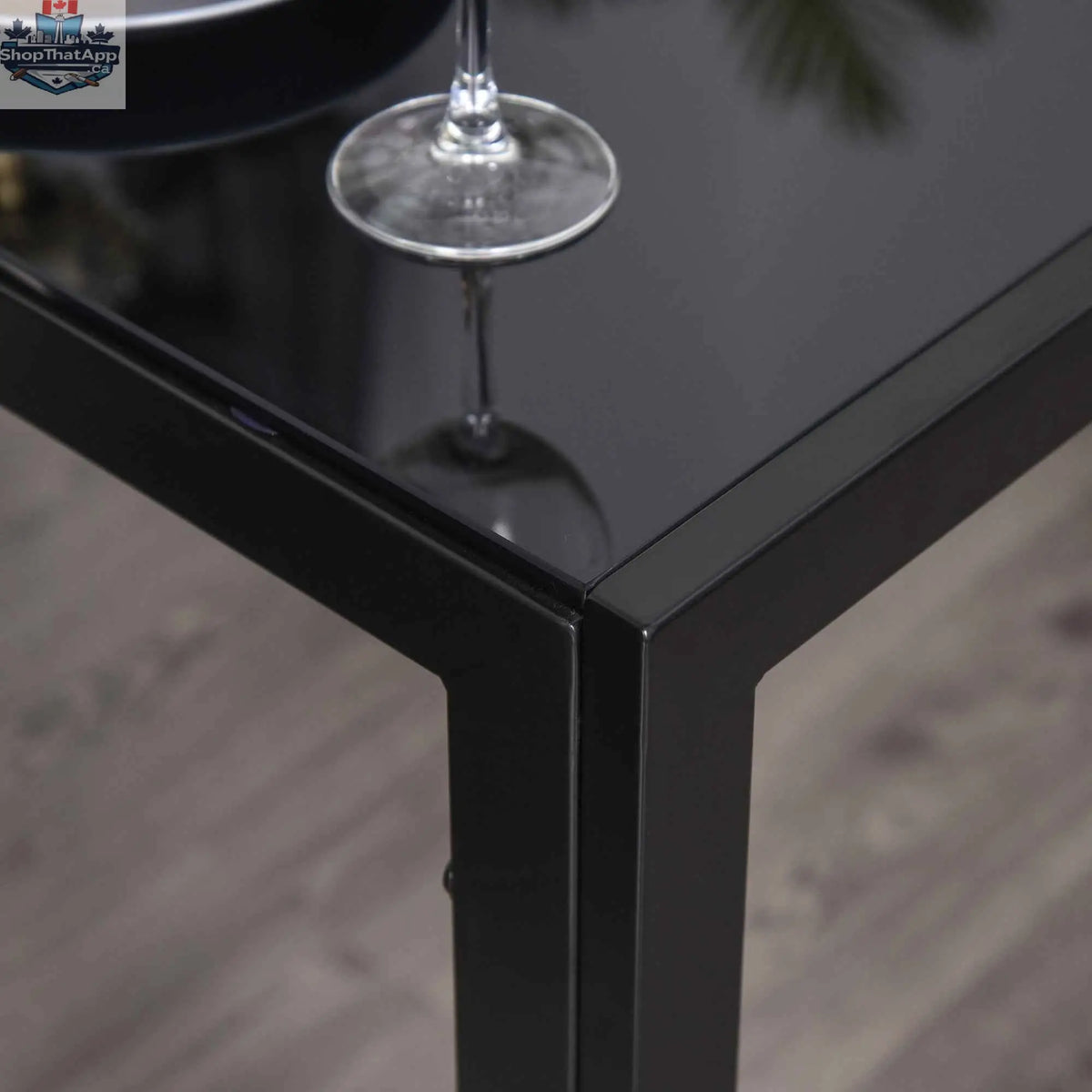 Black Zaya glass dining set by SLOTH Nation with 5 rectangular table and chairs, ideal for small spaces.