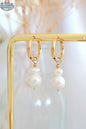 Minimalist pearl earrings by SLOTH Nation, elegant fashion accessories with small pearl accents on sleek metal studs.