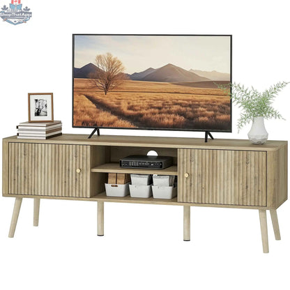 SLOTH Nation Birch TV stand for 65-inch TVs with adjustable shelves and pine wood legs in oak finish.