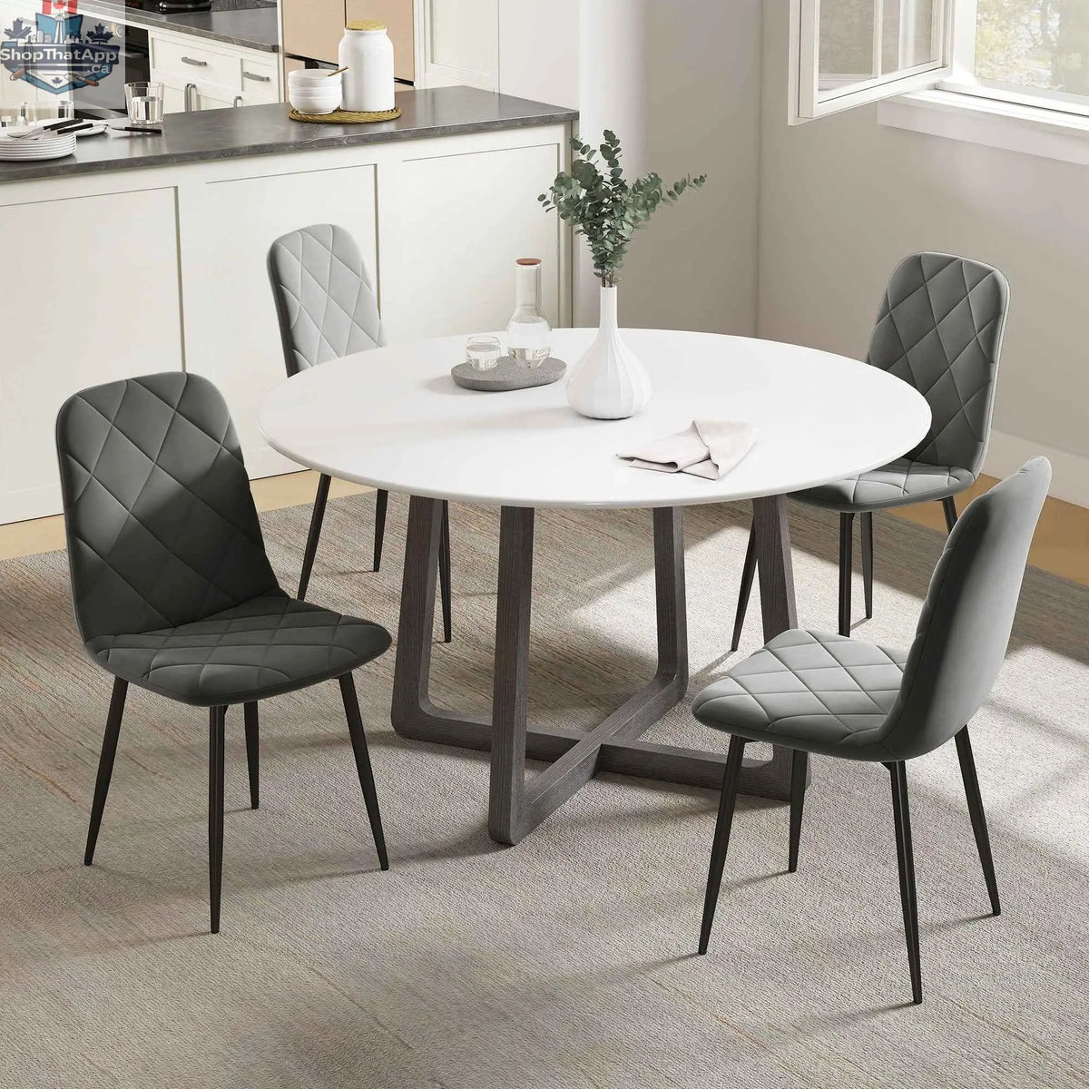 Set of four grey Arbor upholstered dining chairs with steel legs by SLOTH Nation, featuring padded seats and modern design.