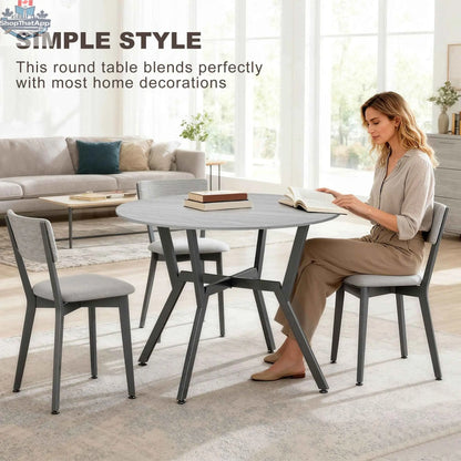 Ainsley 35-inch round dining table with grey surface and steel frame, ideal for kitchen and dining room spaces.