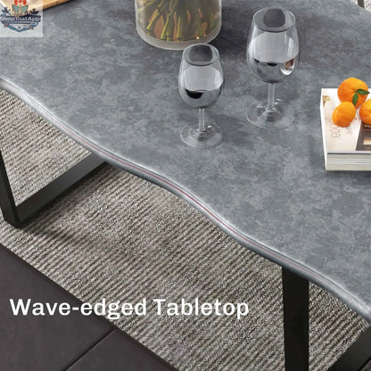 Ashton 63-inch dining table with wave-edged cement grey tabletop and steel legs, modern home furnishings for kitchen and dining.