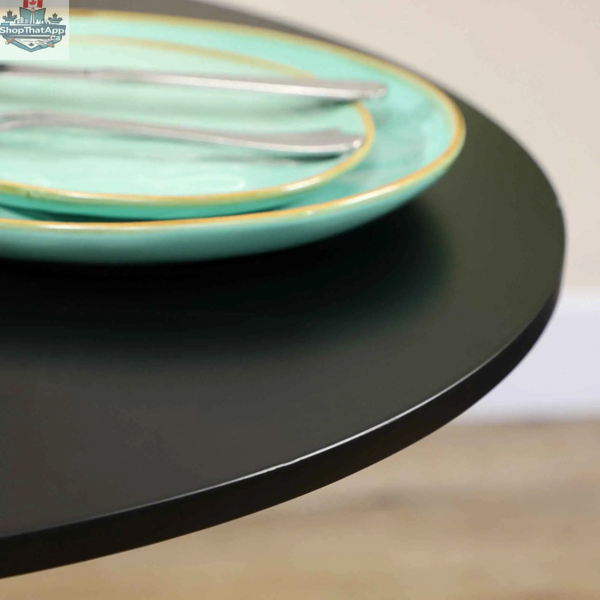 Black Jan Modern round dining table with steel base, perfect for small spaces, from SLOTH Nation home furnishings collection.