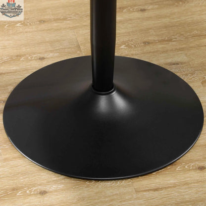 Modern black round dining table by SLOTH Nation with steel base, ideal for small spaces in home kitchen or dining areas.