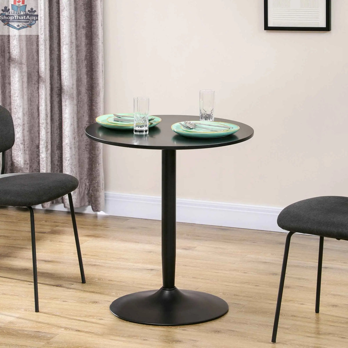 Black Jan Modern round dining table with steel base, perfect for small spaces, by SLOTH Nation for stylish kitchen and dining areas.